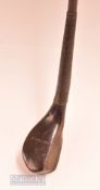 Rare and early A Patrick Leven dark stained curved beech wood niblick - the compact narrow deep face