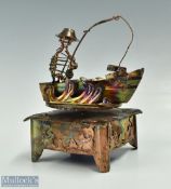 Metal work Fishing Musical ornament depicts a pivoting fisherman in boat with Sankyo musical