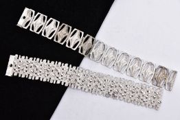 TWO SILVER WIDE BRACELETS, the first of an openwork abstract design, fitted with a double locking
