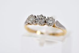 A YELLOW METAL THREE STONE DIAMOND RING, designed with three illusion set diamonds, two old cut