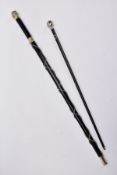 TWO MILITARY RELATED SWAGGER STYLE STICKS, to include a white metal sphere topped with white metal