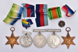 A GROUP OF FOUR WWII MEDALS (1939-45, Atlantic Stars Defence & War Medal), together with a 25th