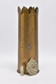 A WWI ERA 18LB SHELL CASE which has a cut out petal style around rim, together with silver