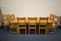 A SOLID OAK EXTENDING DINING TABLE, two additional leaves, on block legs, extended length 250cm x
