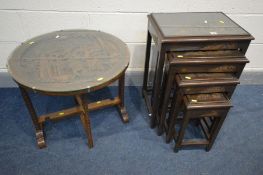AN ORIENTAL HARDWOOD QUARTETTO NEST OF TABLES, with a carved landscape scene to each table below a