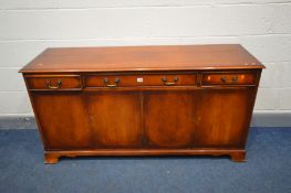 A MAHOGANY SIDEBOARD with three drawers, width 154cm x depth 46cm x height 78cm