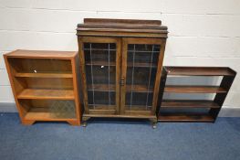 AN EARLY 20TH CENTURY OAK BOOKCASE, raised back, lead glazed effect doors enclosing two adjustable