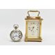 A BRASS CARRIAGE CLOCK AND A MILITARY POCKET WATCH, a white enamel face with black Roman numerals, - Image 1 of 7