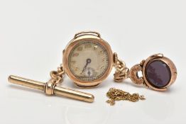 THREE ITEMS OF JEWELLERY, to include a circular 1920's 9ct gold watch head with Arabic numerals,