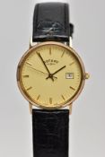 A 9CT GOLD ROTARY QUARTZ WRISTWATCH, cream dial with baton markers and date window at three o'clock,