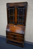 AN EARLY 20TH CENTURY OAK LEAD GLAZED BUREAU BOOKCASE, width 89cm x depth 42cm x height 200cm