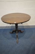 A GEORGIAN OAK CIRCULAR TILT TOP TRIPOD TABLE, on a turned support and splayed legs, diameter 79cm x