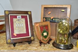 A FRAMED AND MOUNTED CHRISTMAS GREETING with four miniature ceramic figures, 12cm x 9cm, together