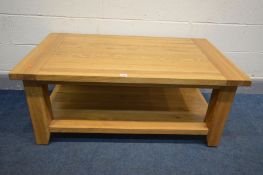 A SOLID OAK COFFEE TABLE, on block legs united by an undershelf, length 120cm x depth 70cm x