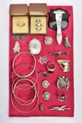 A SELECTION OF SILVER AND WHITE METAL JEWELLERY, to include two hinged silver bangles, an oval