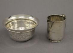 WITHDRAWN A silver cream jug and a silver bowl. The former 7 cm high. 5.3 troy ounces.