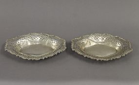 A pair of pierced silver bon bon dishes. Each 21 cm wide. 6.1 troy ounces.