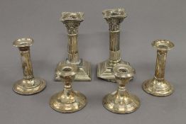 Three small pairs of silver candlesticks. The largest 15.5 cm high. 46.7 troy ounces weighted.
