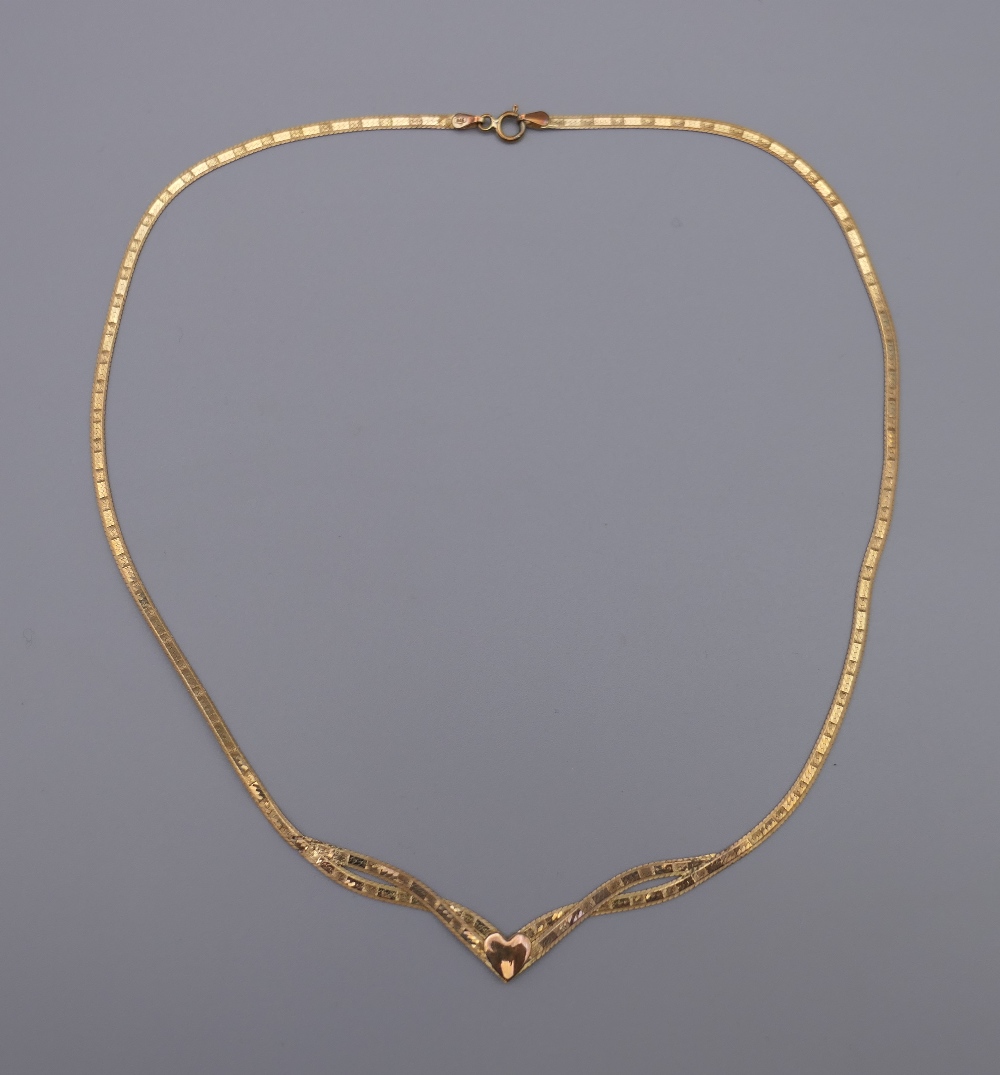 A 9 ct gold snake herringbone necklace. 40 cm long. 3 grammes.
