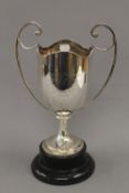 An engraved silver trophy cup on stand. 36 cm high overall. 22.1 troy ounces.