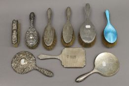A quantity of silver backed dressing table brushes and mirrors. 52.8 troy ounces total weight.