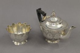 A Victorian silver sugar bowl (3.2 troy ounces) with matching unmarked white metal teapot.