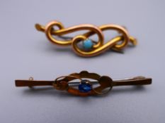 An unmarked gold turquoise set brooch and a 9 ct gold brooch. The former 4 cm wide. 3.