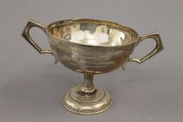 An engraved silver trophy cup. 13 cm high. 11.5 troy ounces.