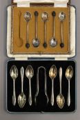 A cased set of silver teaspoons and tongs, and a part set of silver coffee spoons. 4.