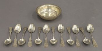 An Egyptian silver bowl and Chinese silver spoons. The former 12 cm diameter. 9.4 troy ounces.