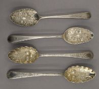 Two pairs of Georgian silver berry spoons (later embossed) . Each 22.5 cm long. 7 troy ounces.