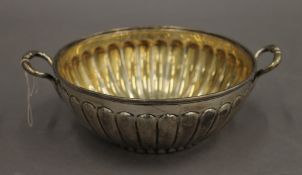 A silver twin handled bowl. 18.5 cm diameter including handles. 8.8 troy ounces.