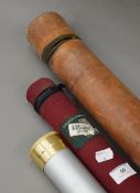 A leather rod case, an Orvis canvas rod case and an aluminium rod case.