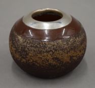 A silver mounted stoneware match striker. 4.5 cm high.