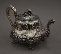 A Victorian Elkington and Co EPNS teapot with flower finial. 17 cm high.