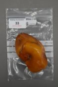 A large piece of polished amber. 105.3 grammes.