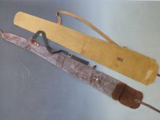 Two vintage gun slips, one leather the other canvas.