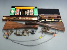A collection of shotgun parts including stocks, locks etc together with three shotgun cleaning kits,