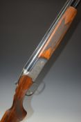 Lincoln 12 bore over and under ejector shotgun with engraved scenes of dogs and birds to the lock,