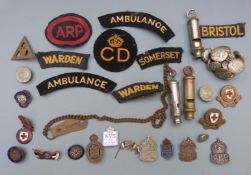 British WW2 Home Front ephemera including three A.R.P silver badges, buttons, whistles, cloth badges