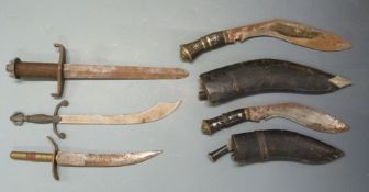 Five daggers including two kukris both with sheaths, largest with 29cm blade. PLEASE NOTE ALL BLADED