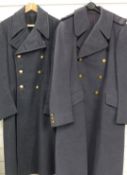 Two Royal Air Force great coats with buttons and insignia