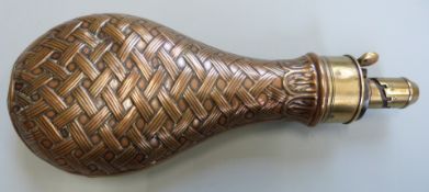 G & JW Hawksley copper and brass powder flask with embossed basket weave decoration, 21cm long