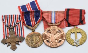 Four Czechoslovakia medals comprising 1914-1918 Revolutionary Cross, 1939 Military Cross, Medal