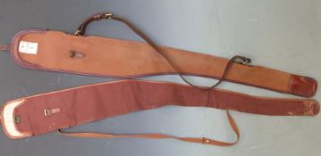 Two vintage gun slips, one Holland and Holland the other Brady, both with original labels.
