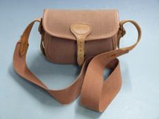 Brady leather and canvas shotgun cartridge bag with shoulder strap.