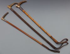 Three horn handled riding crops with hallmarked silver mounts