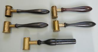 Five brass adjustable shot and powder measures all with turned wooden handles, one by G & J W