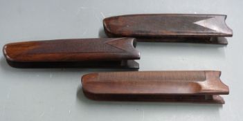 Three Beretta chequered shotgun forends, 24 and 24.5cm long.