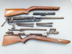 A collection of BSA and other air rifle parts including stocks, springs, barrels, scope etc.